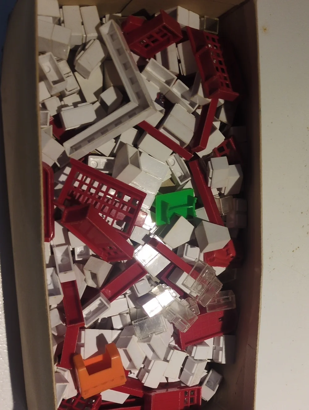 Assorted Kids Building Set Pieces in Red, White, Green, Orange